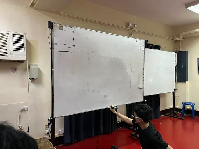 The PolyCast marker being used on a standard classroom whiteboard
